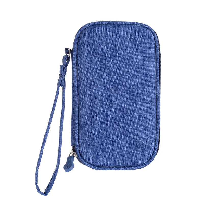 Blue travel cable organiser, closed, with zip fastening and wrist strap