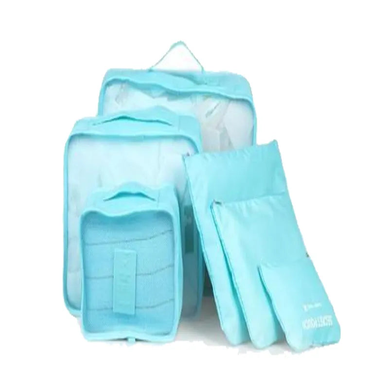 Blue six-piece packing set with three mesh-top zip organisers and three flat zip pouches